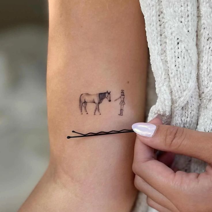 A person hydrates their skin in preparation for a new horse tattoo.